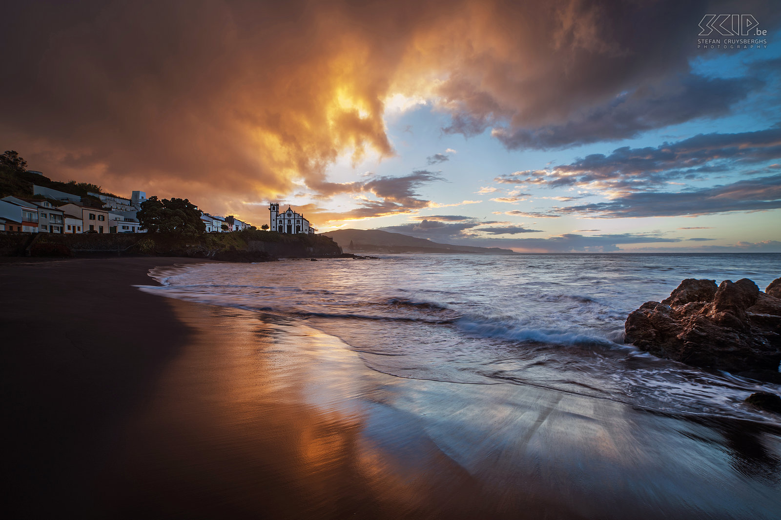 Sunrise Sao Roque Threatening rain clouds at sunrise on the black sandy beach of São Roque with in the background the white church. A few minutes later there was a rain storm. Stefan Cruysberghs